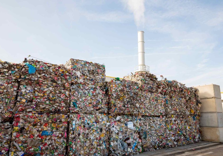 Waste-to-energy or energy-from-waste is the process of generating energy in the form of electricity or heat from the primary treatment of waste. Cubes of pressed metal beer and soda cans.